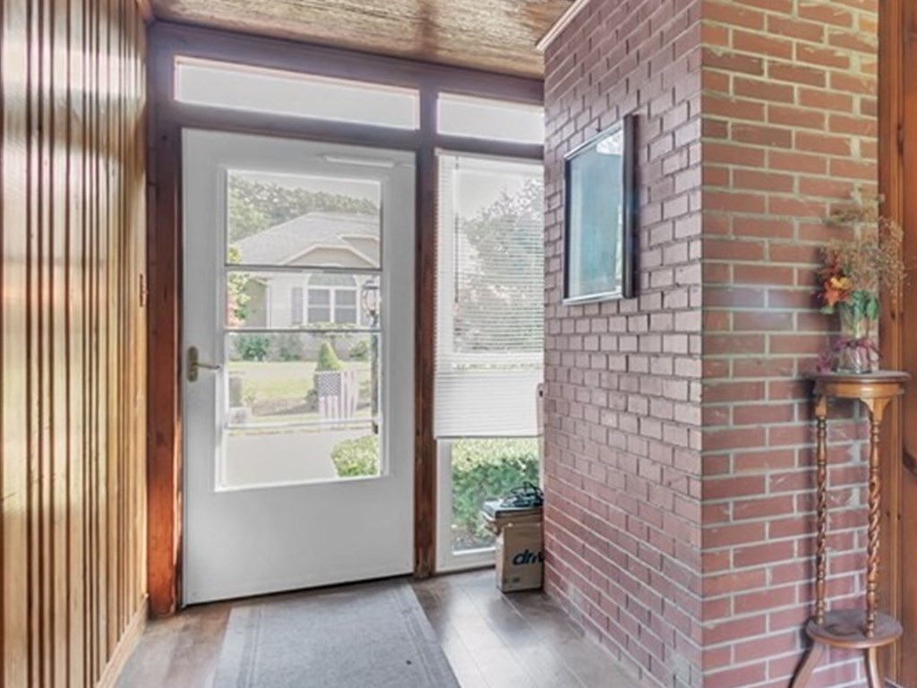 48 Greenlawn Street Springfield, MA 01119 - Photo 38 of 39 a brick building with a potted plant next to a window