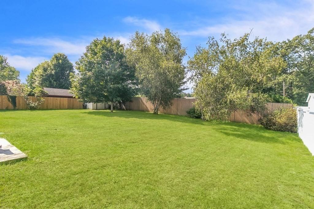 48 Greenlawn Street Springfield, MA 01119 - Photo 9 of 39 a view of a house with a yard