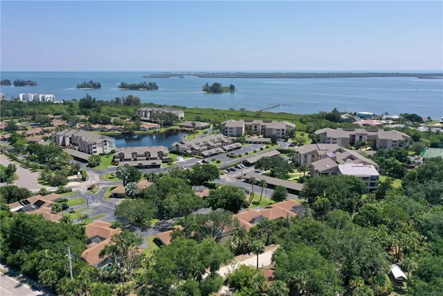 an aerial view of a house with swimming pool big yard and outdoor seating