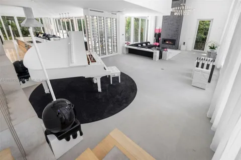 a view of a patio with table and chairs with wooden floor and fence