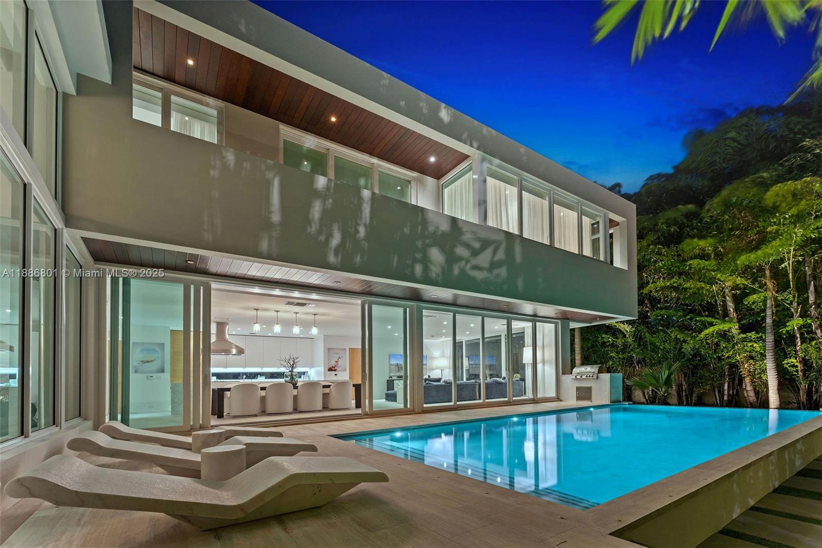 4433 North Bay Road Miami Beach, FL 33140 - Photo 17 of 71 a view of a house with pool and sitting area