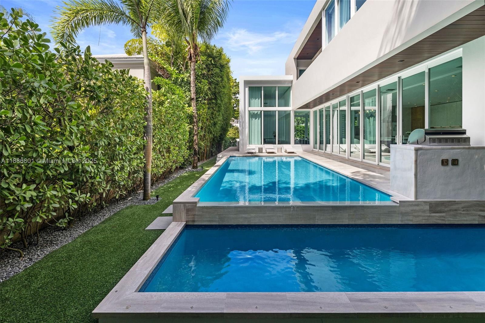 4433 North Bay Road Miami Beach, FL 33140 - Photo 24 of 71 a view of swimming pool with a yard