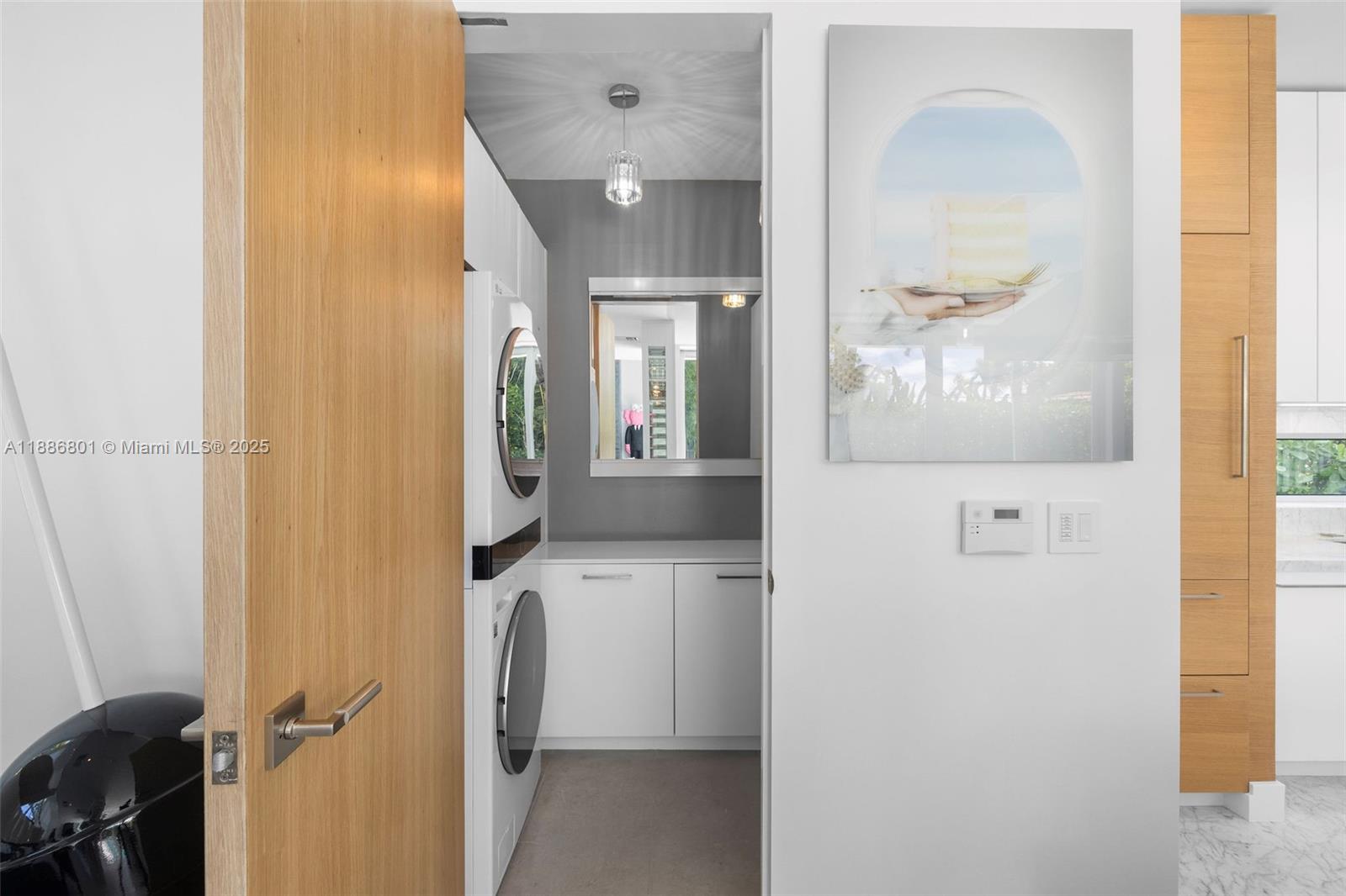 4433 North Bay Road Miami Beach, FL 33140 - Photo 41 of 71 a view of a bathroom from a hallway