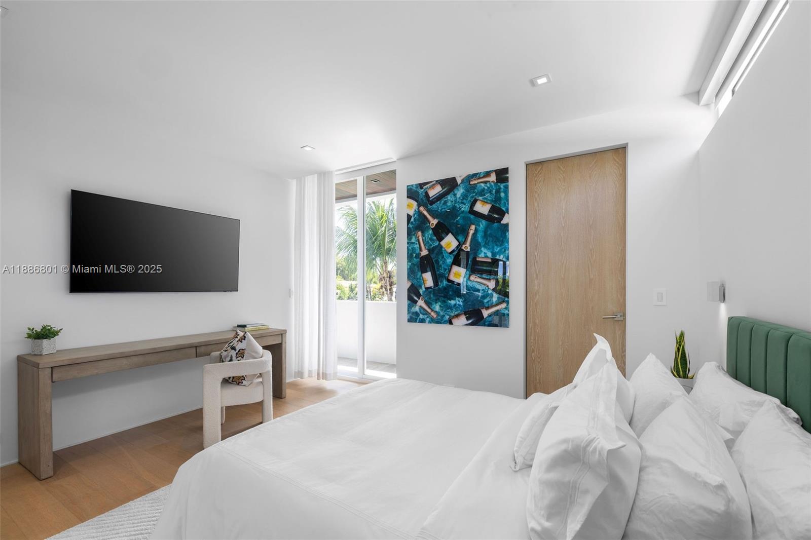 4433 North Bay Road Miami Beach, FL 33140 - Photo 46 of 71 a bedroom with a bed and a flat screen tv