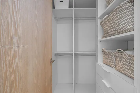 a bathroom with a tub a sink and mirrors