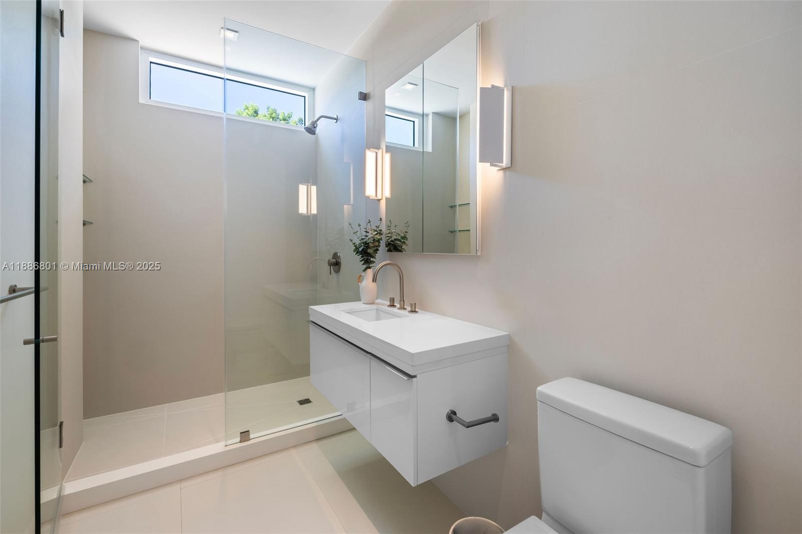 4433 North Bay Road Miami Beach, FL 33140 - Photo 52 of 71 a bathroom with a sink toilet and shower