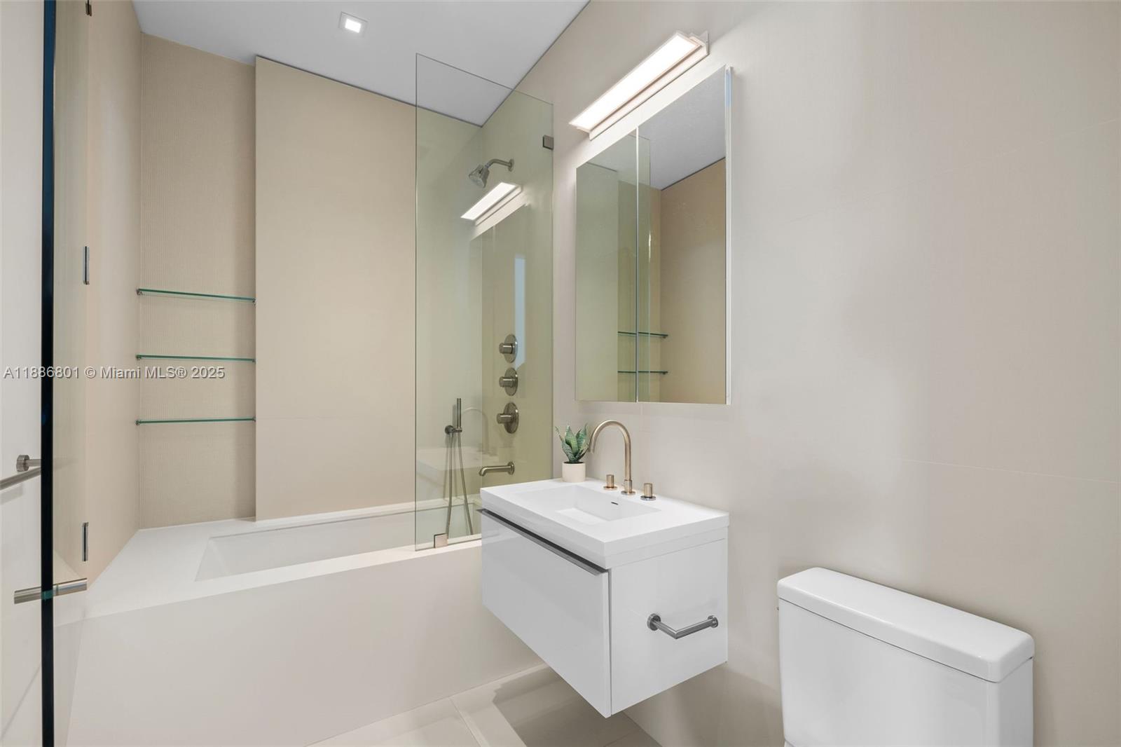 4433 North Bay Road Miami Beach, FL 33140 - Photo 56 of 71 a bathroom with a sink toilet and shower