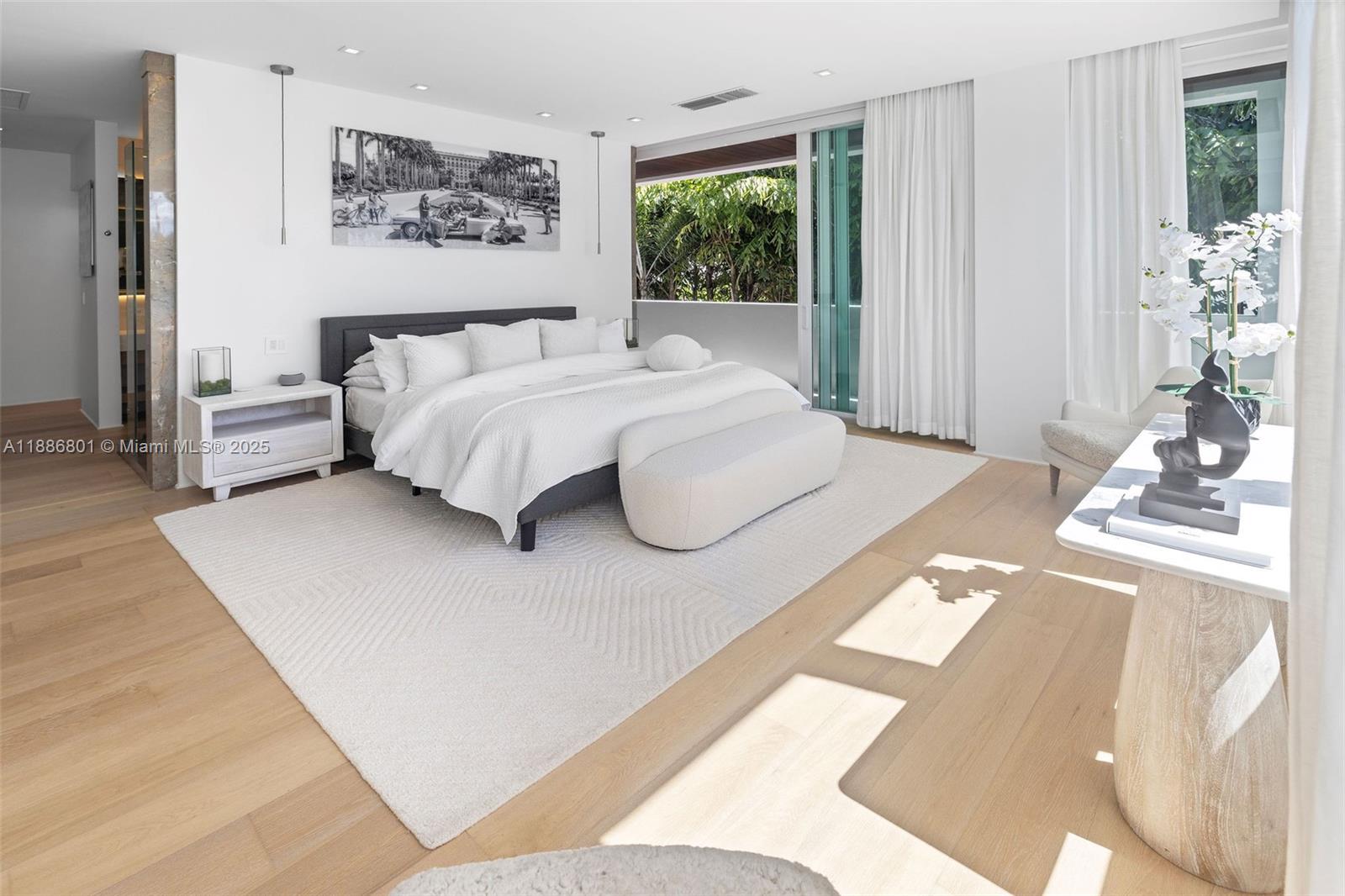 4433 North Bay Road Miami Beach, FL 33140 - Photo 57 of 71 a bedroom with a bed and a large window