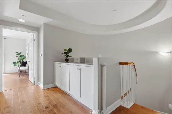 a view of hallway with wooden floor