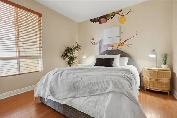 a bedroom with a bed and window