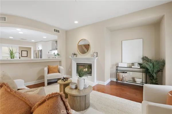 a living room with furniture and a fireplace