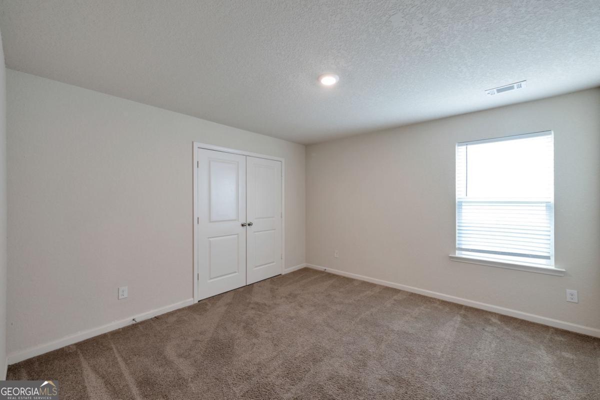 2889 Cleburne Terrace Hampton, GA 30228 - Photo 14 of 25 an empty room with a window