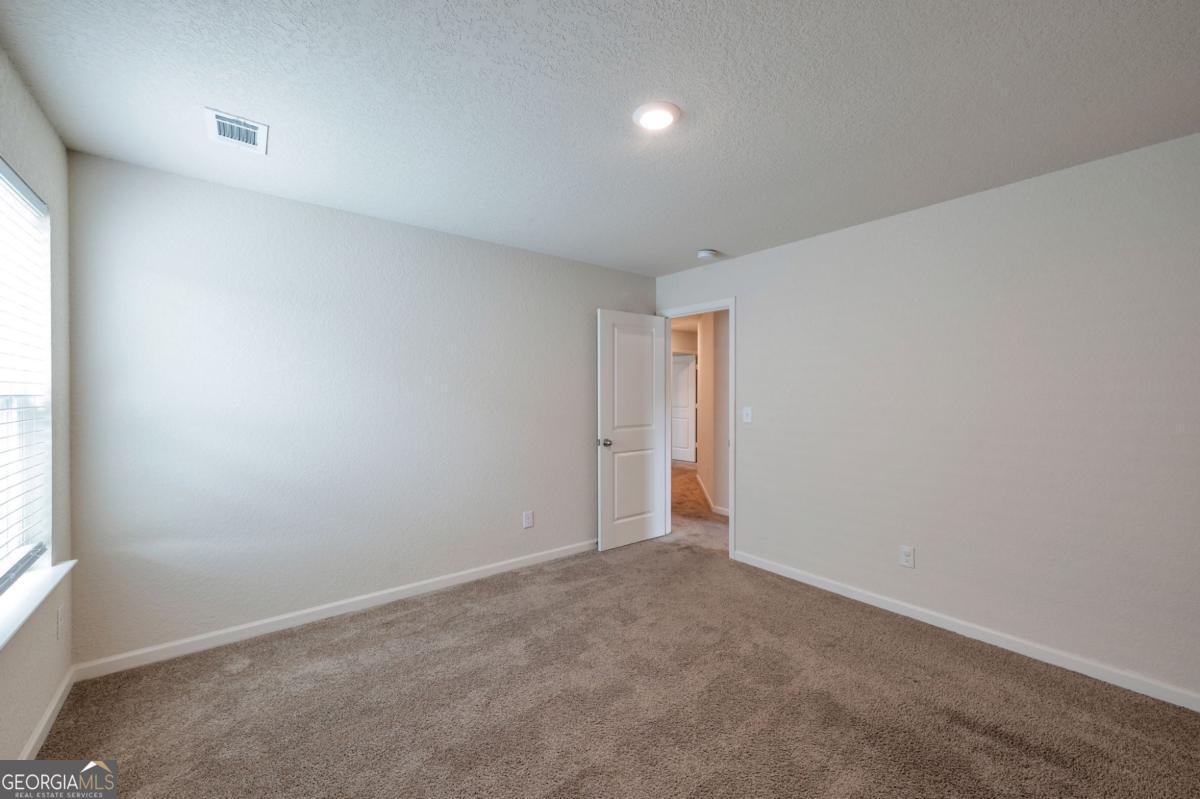 2889 Cleburne Terrace Hampton, GA 30228 - Photo 15 of 25 an empty room with windows
