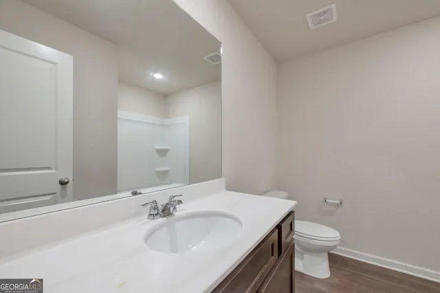 a bathroom with a sink and a toilet