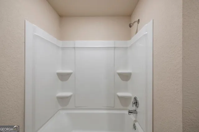 a bathroom view with a shower