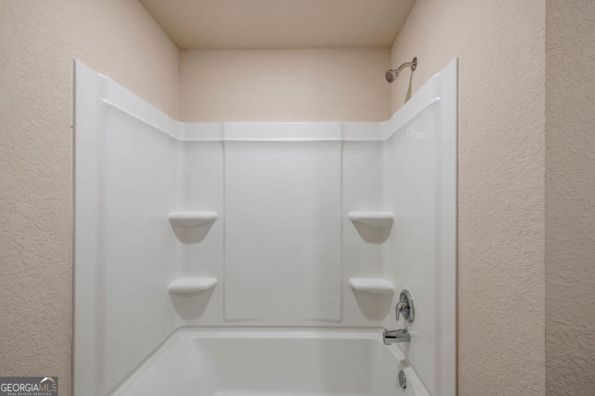 2889 Cleburne Terrace Hampton, GA 30228 - Photo 20 of 25 a bathroom view with a shower