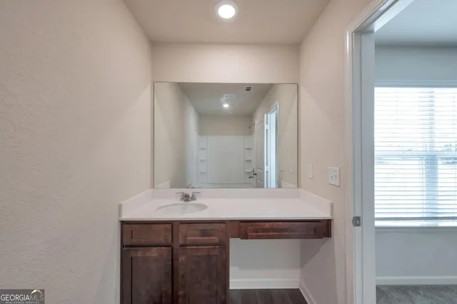 a bathroom with a sink and a mirror