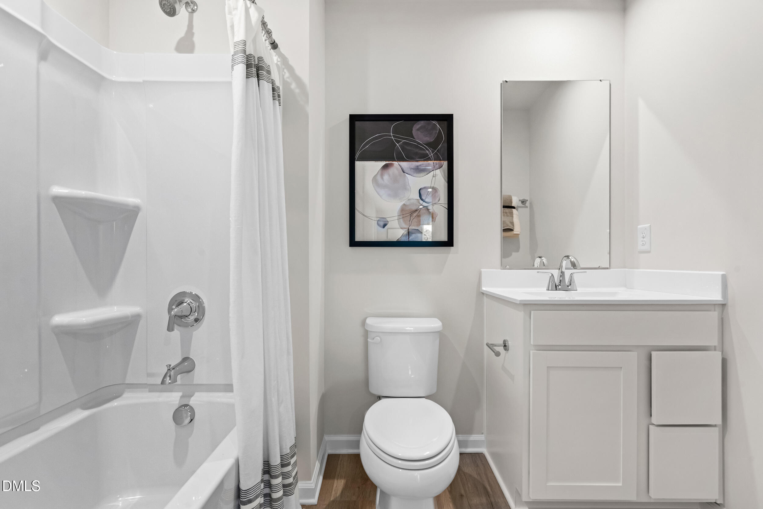 49 Better Day Way Lillington, NC 27546 - Photo 25 of 29 a bathroom with a sink a toilet and a bathtub