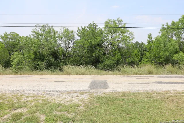 a view of a field with an outdoor space