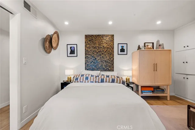 a bedroom with bed and a window