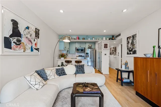 a living room with furniture and large window