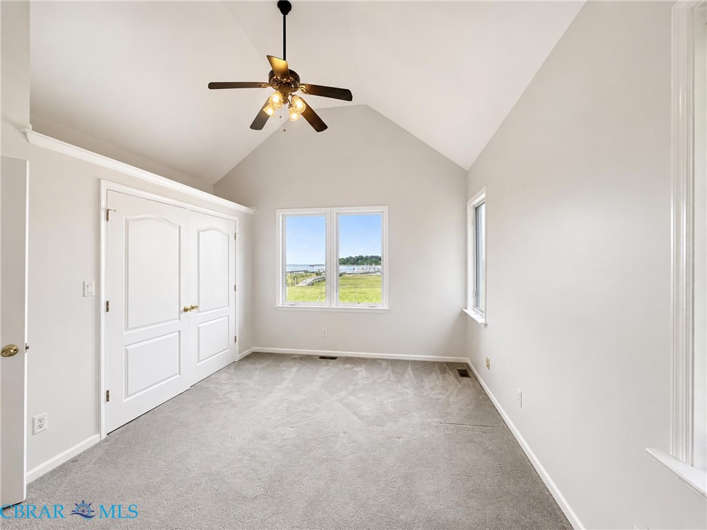 1214 Dandy Loop Road Yorktown, VA 23692 - Photo 34 of 65 an empty room with windows and fan