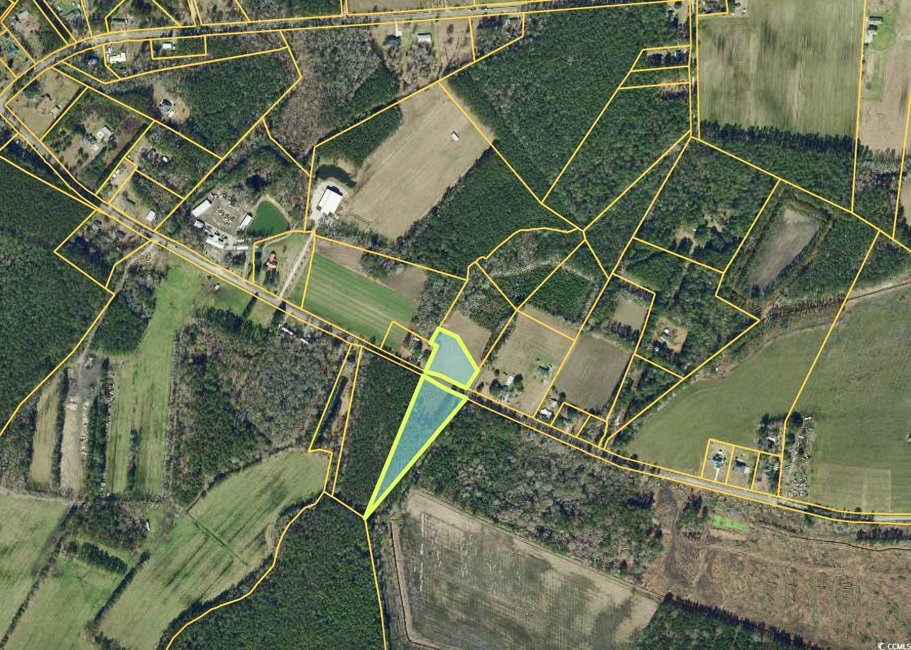 Aerial view of property's location featuring property parcel outlined