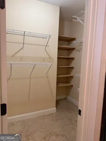 a view of a room with racks on the wall