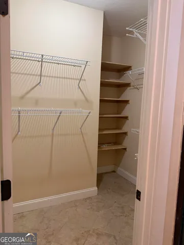 a view of a room with racks on the wall