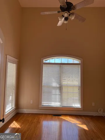 a kitchen with granite countertop stainless steel appliances a refrigerator stove top oven and sink