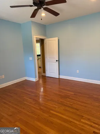 a view of a livingroom with furniture and wooden floor