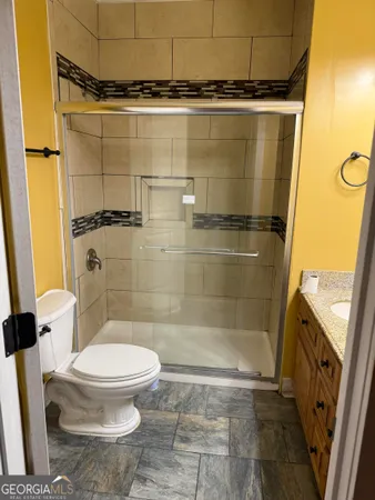 a utility room with sink dryer and washer