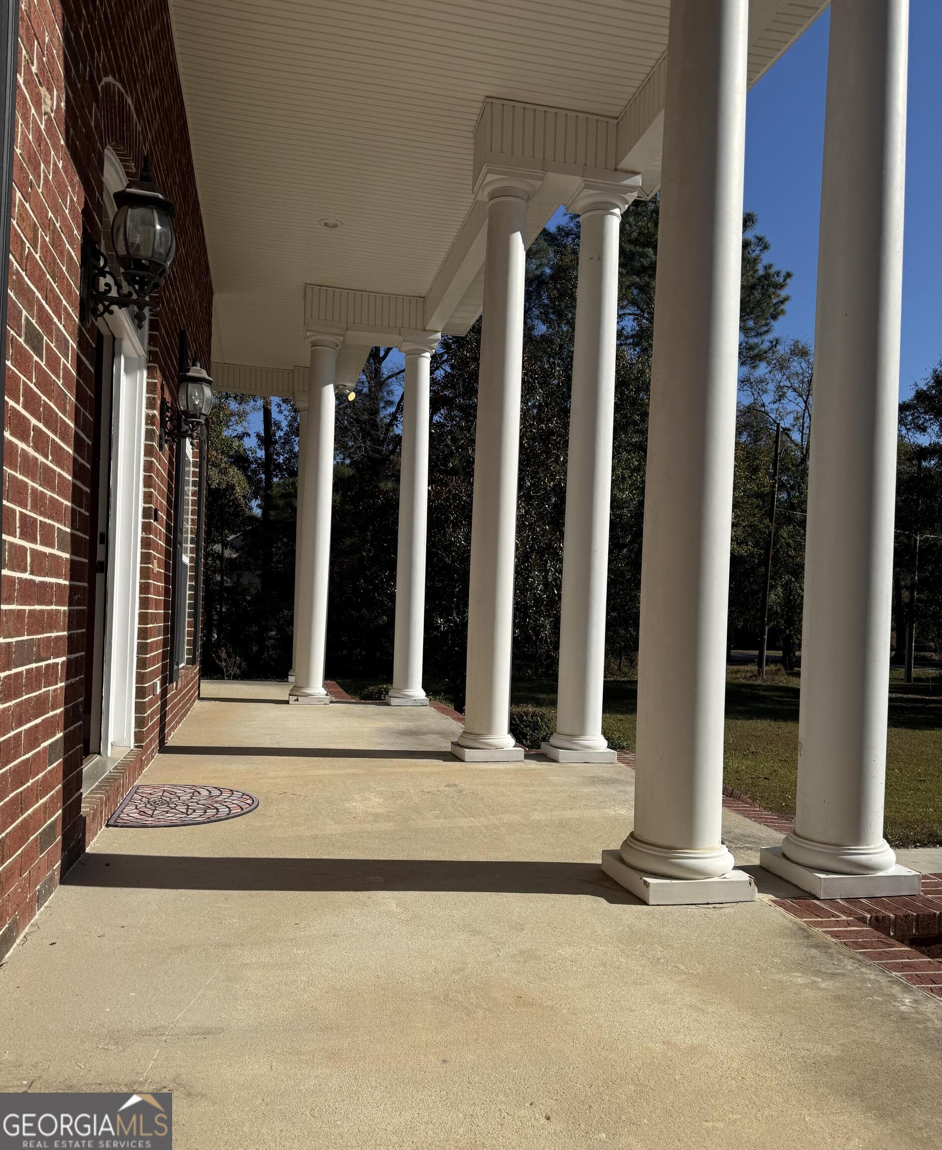 713 West Lane Street Brooklet, GA 30415 - Photo 3 of 39 a view of a building with floor to ceiling window and an outdoor space