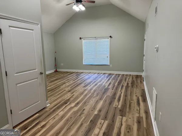 a view of balcony with wooden floor