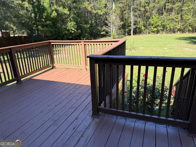 a view of balcony with wooden floor