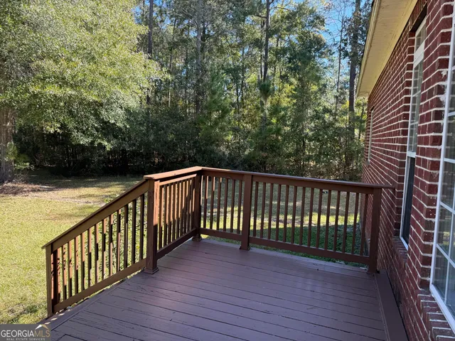 a view of a house with a small yard