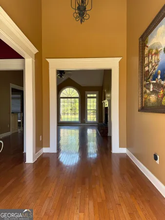 a view of livingroom with hardwood floor and hallway