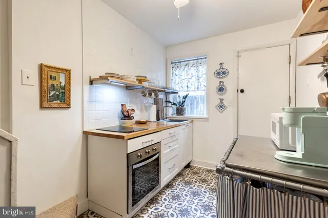 a kitchen with stainless steel appliances granite countertop a stove and a refrigerator