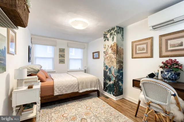 a bedroom with a bed and a chair