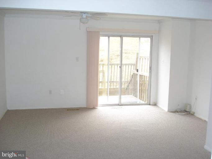 46 Ritters Ridge Court, Unit 46 Owings Mills, MD 21117 - Photo 4 of 8 a view of an empty room with a window