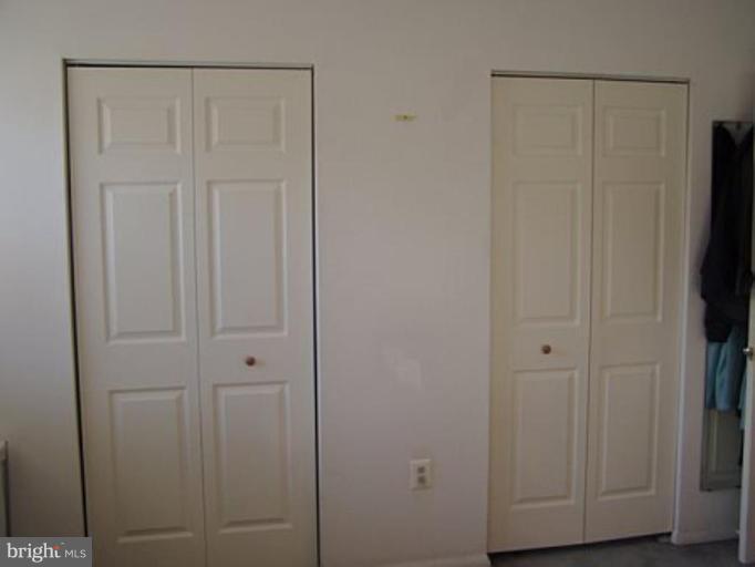 46 Ritters Ridge Court, Unit 46 Owings Mills, MD 21117 - Photo 7 of 8 a view of wooden closet