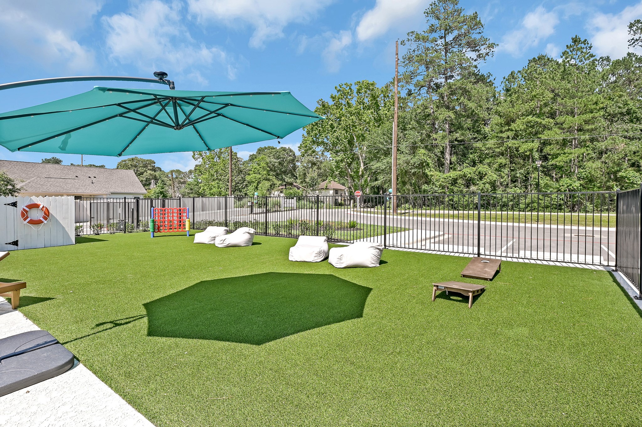 33455 Buckshot Lane, Unit 83 Spring, TX 77382 - Photo 20 of 22 Green space with outside games and plenty of outdoor seating!