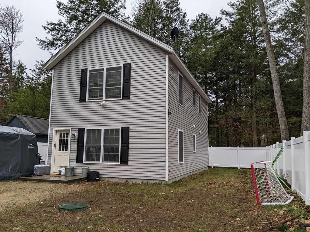 9 Cheshire Road Rindge, NH 03461 - Photo 1 of 2 a view of a house with a yard and large tree
