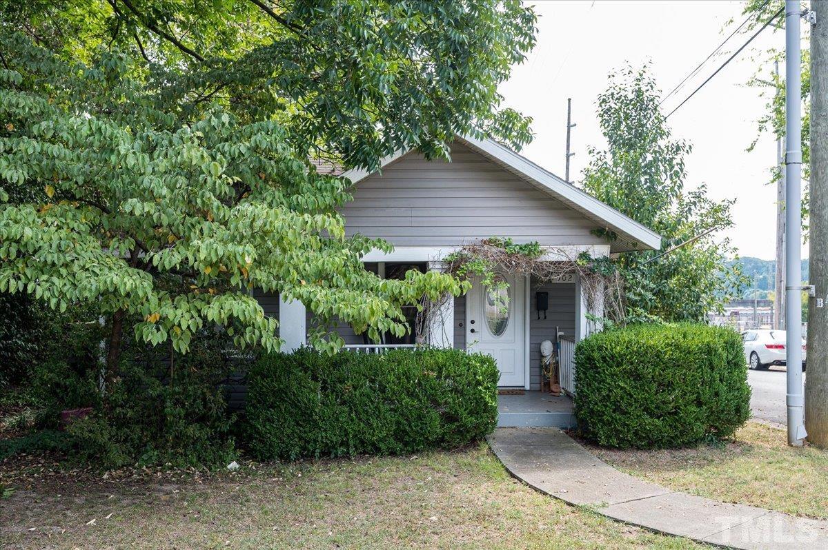 302 Georgetown Road Raleigh, NC 27608 - Photo 1 of 19 a view of a house with potted plants