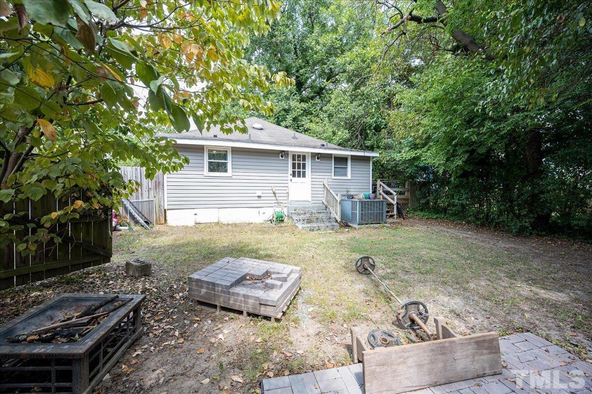 302 Georgetown Road Raleigh, NC 27608 - Photo 18 of 19 a backyard of a house with yard barbeque oven and outdoor seating