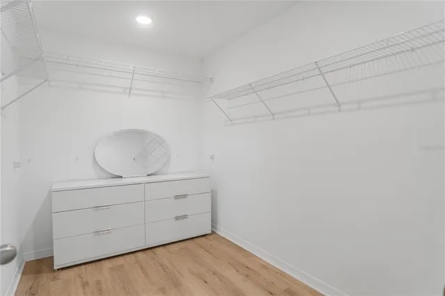 a view of a swimming pool with an outdoor seating