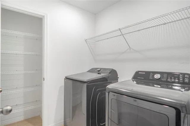 an aerial view of a swimming pool with a yard