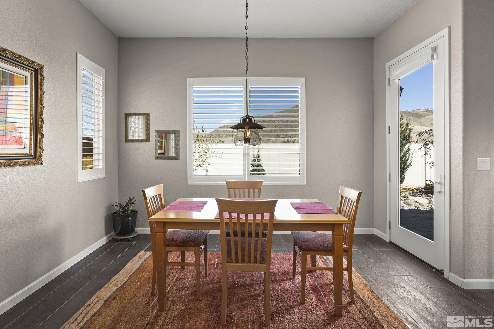 2975 Show Jumper Lane Reno, NV 89521 - Photo 12 of 32 a view of a dining room with furniture window and outside view
