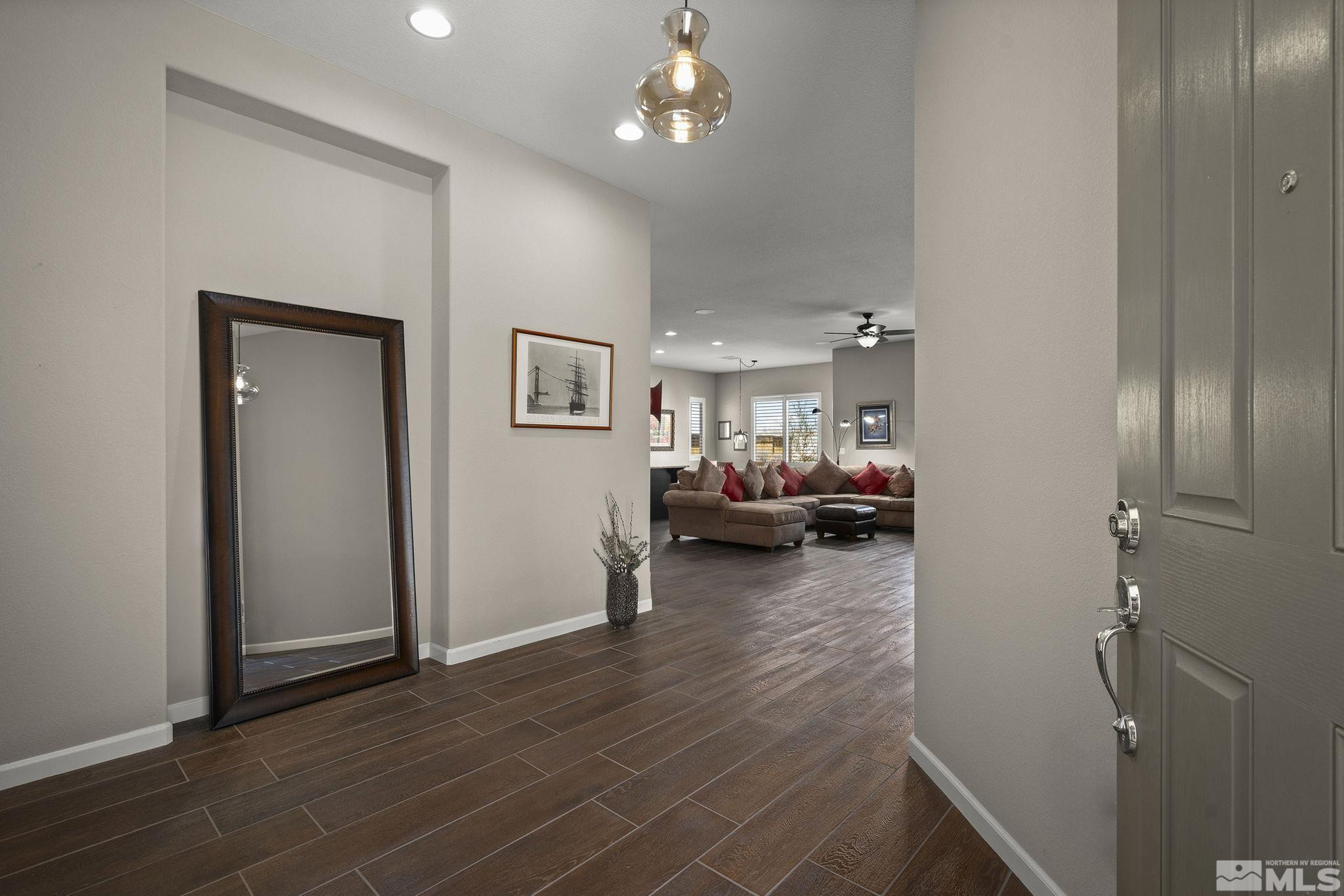 2975 Show Jumper Lane Reno, NV 89521 - Photo 16 of 32 a living room with furniture and a wooden floor