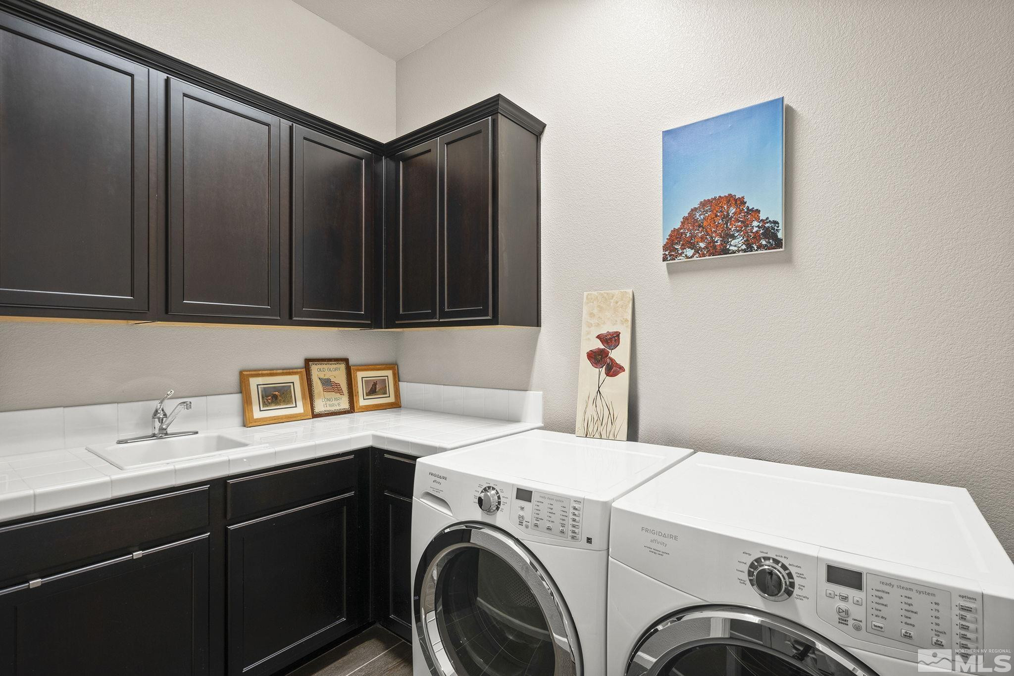2975 Show Jumper Lane Reno, NV 89521 - Photo 17 of 32 a utility room with dryer and washer